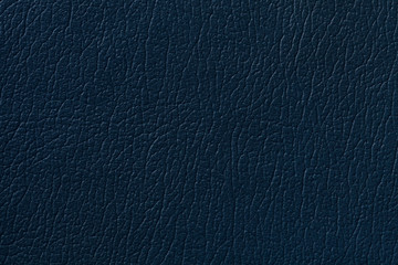 Dark blue leather texture background with pattern, closeup.