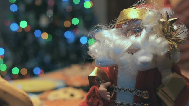 Toy Santa Under The Christmas Tree and Holiday Table 1