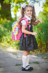 Little pretty schoolgirl on the street