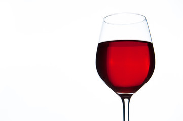 Glass of red wine isolated. Copyspace