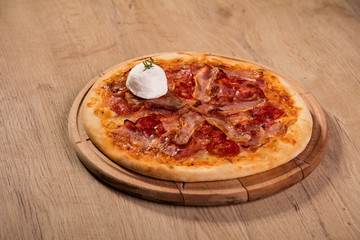 Pizza served on wooden board
