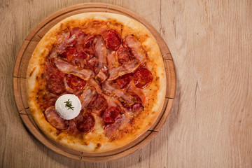 Pizza served on wooden board