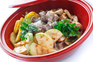 vegetable stew with meat,mushroom and herbs on a white background