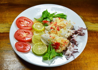 steamed squid stuffed minced pork dressing spicy lemon sauce