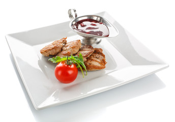 Grilled serving steak with tomato, fresh herbs and sauce