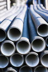 background of colorful grey plastic pipes used at the building site.