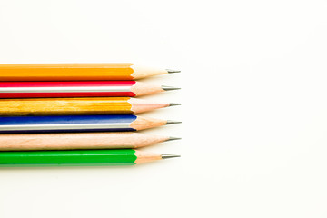 Pencils of different colors are on white.
