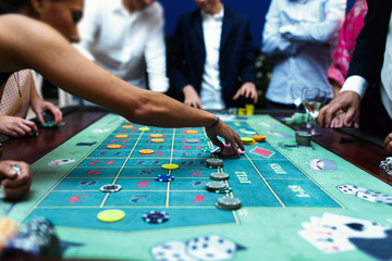 Fototapeta premium People play poker in the casino