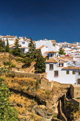 Buildings on the cliffside of El Tajo Gorge in Ronda, Malaga province, Spain.