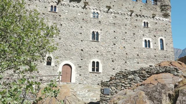 Ch&acirc;tillon, Aosta valley, Italy. View of medieval Castle of Ussel with mountains landscape and blue sky. Summer holidays, history and italian tourism destination