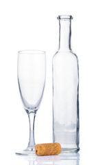 Empty bottle and wineglass on white background