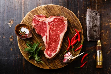 Peel and stick wall murals Steakhouse Raw fresh meat T-bone steak, seasoning and Butcher cleaver on ch