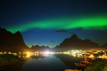Fototapeta na wymiar Nothern Lights and Reine, Lofoten Islands, Norway
