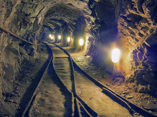 Underground tunnel with train tracks.Mine.