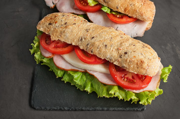 Sandwich with ham and tomatoes