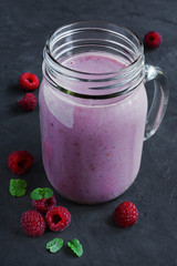 Raspberry smoothie in a glass jar