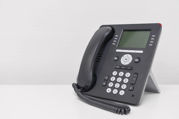 Black IP Phone on the white screen