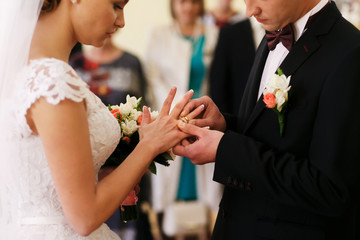 Obraz na płótnie Canvas Newlyweds with rings