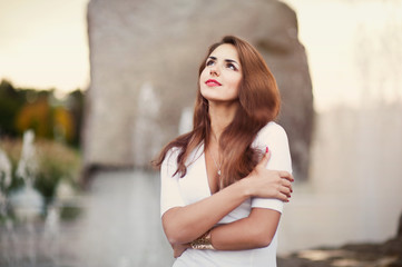 beautiful woman hugging herself