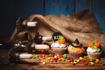 Halloween cupcakes with colored decorations