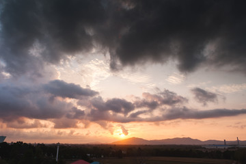 Fototapeta na wymiar Dramatic sunset sky with orange and blue colored clouds.