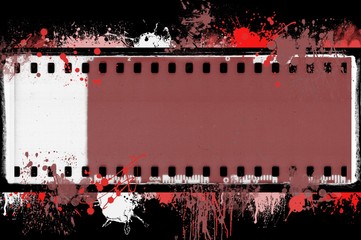 Obraz premium Grunge splashed film strip frame on black background