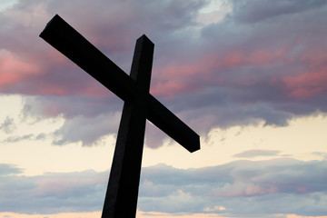 Cross silhouette and the clouds