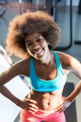 Fototapeta na wymiar afro american girl posing at the gym