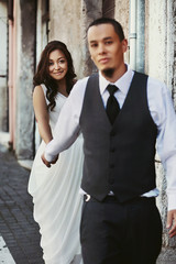 .Happy stylish smiling asian couple