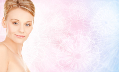 Naklejka premium beautiful young woman face over beige background