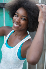 Fototapeta na wymiar Portrait of a young black woman, model of fashion in urban backg