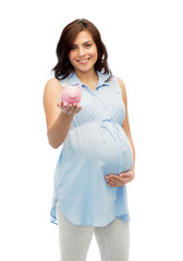 happy pregnant woman with piggybank