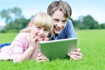 Happy children using tablet PC