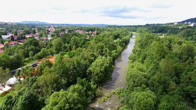 Mountain river and green riverbank from above. Ustron. Poland