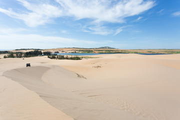 off road car vehicle in white sand dune desert at Mui Ne