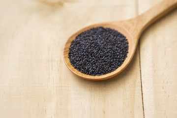 Black sweet basil seed on wooden spoon