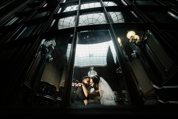 Beautiful bride and groom together in mirror reflection