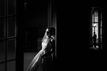 beautiful and young bride standing alone in the room