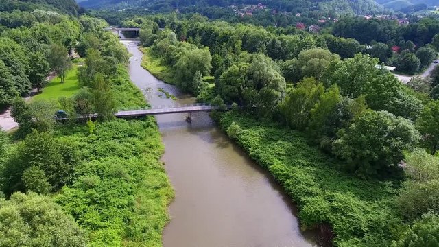 Mountain river and green riverbank from above. Ustron. Poland