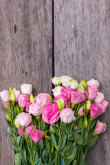 Beautiful bouquet of pink roses on wood background, outdoor