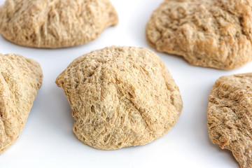Textured vegetable protein on white background.