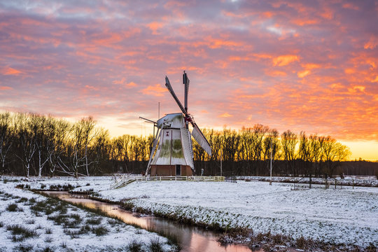 Witte Molen (White Mill) Dutch windmill in winter at sunset