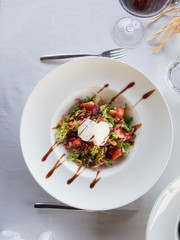 aerial salad in white bowl plate