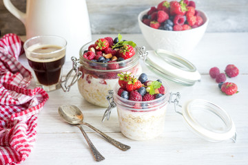Overnight oats (Bircher muesli) with berries for healthy beautiful breakfast