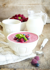 Healthy paleo vegetarian berry mousse porridge with semolina and berry puree for breakfast