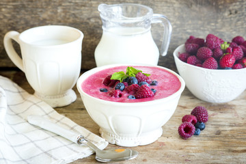 Healthy paleo vegetarian berry mousse porridge with semolina and berry puree for breakfast