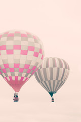 Naklejka premium Two vintage hot air balloons in flight