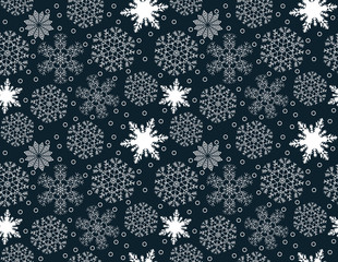 Seamless pattern of white snowflakes on a blue background