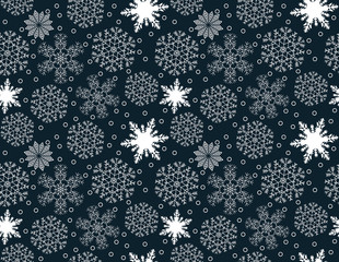 Seamless pattern of white snowflakes on a blue background