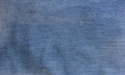 Jean texture background pale light blue and white denim natural pattern worn fabric clothes with diagonal lines and stitches